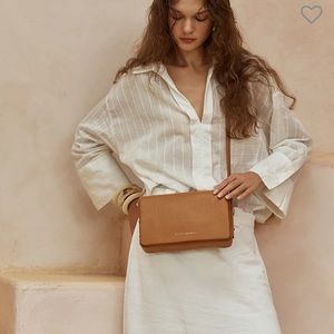 Status anxiety crossbody bad - succomb